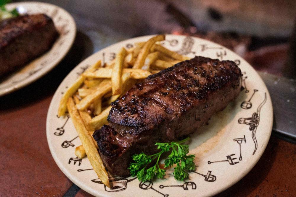 steak and fries on a plate